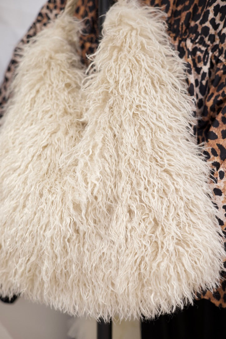 Sac fourré en mouton beige à poignées cordées